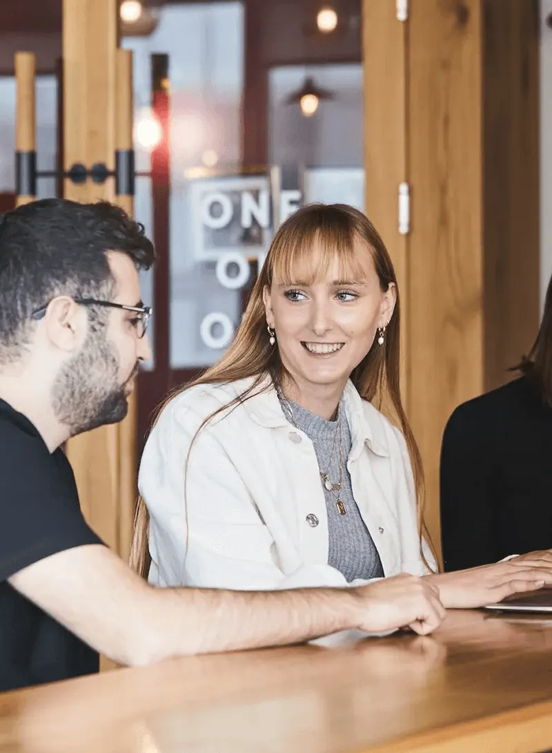 Four co-workers conversing